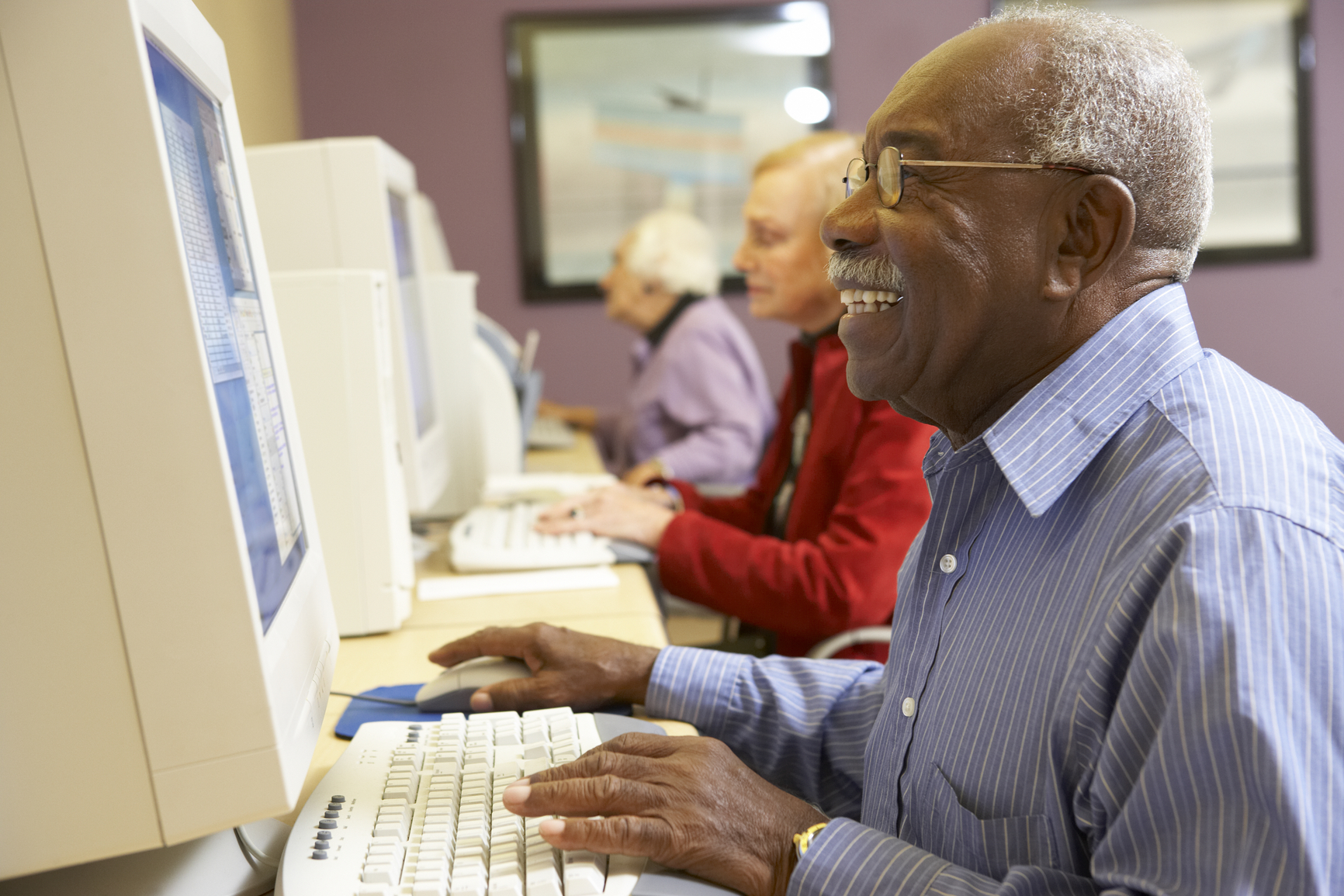 senior citizen at computer